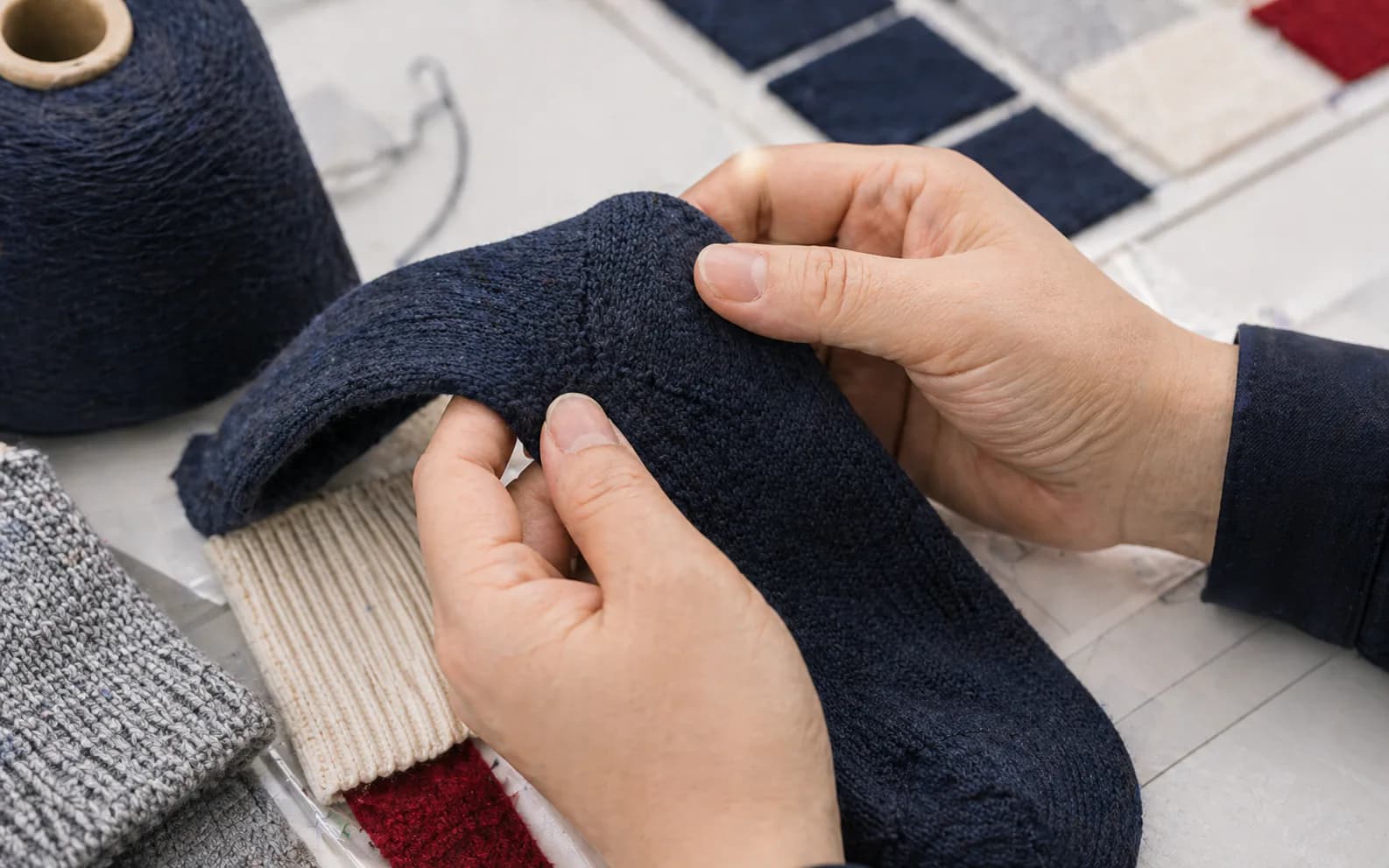 Close inspection of knit structure and sample quality during program review